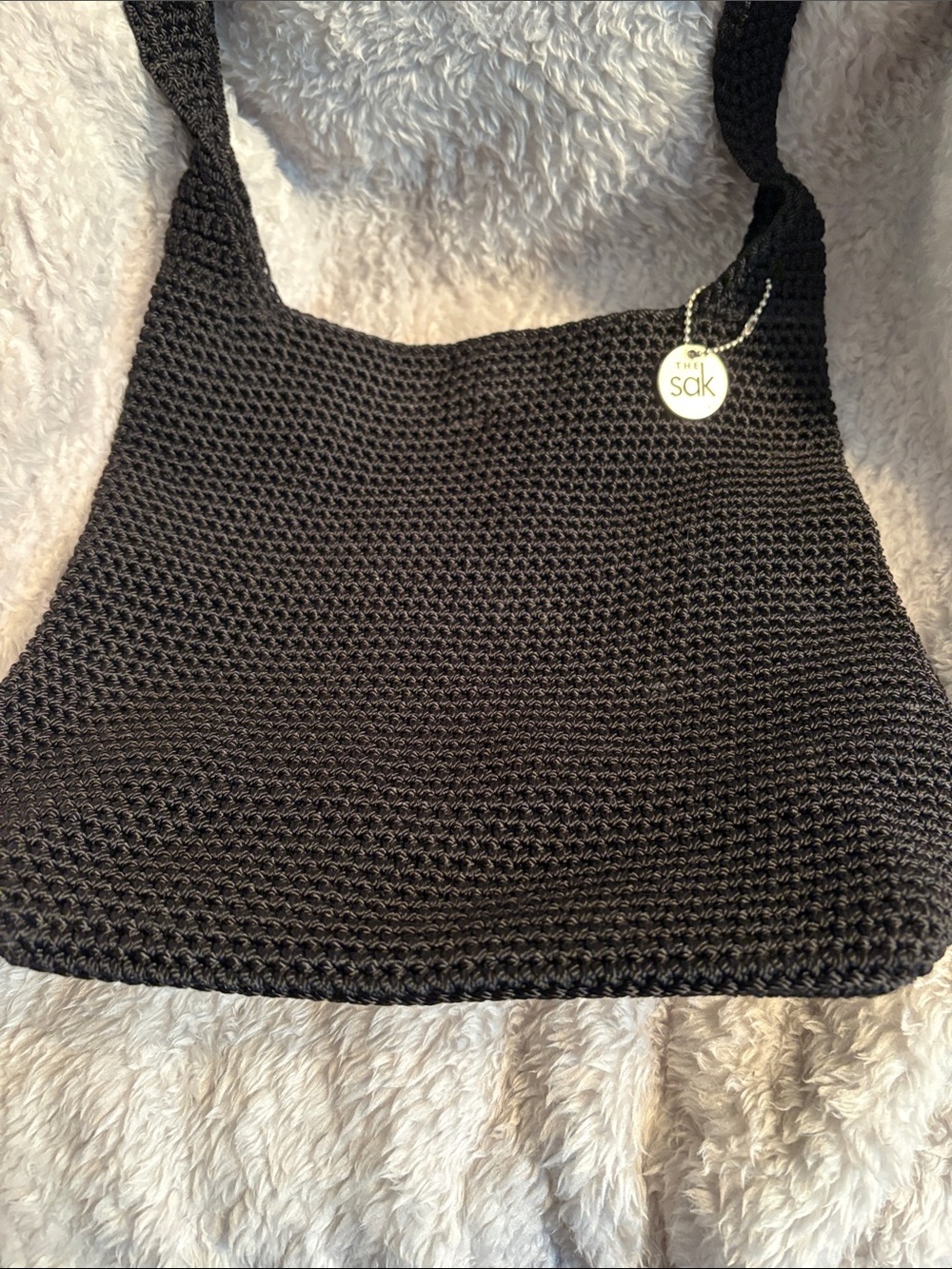 The Sak Black Crochet Shoulder Bag with Branded Charm